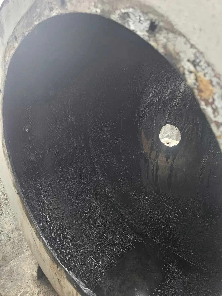 Heavy grease deposit inside a blower housing before cleaning