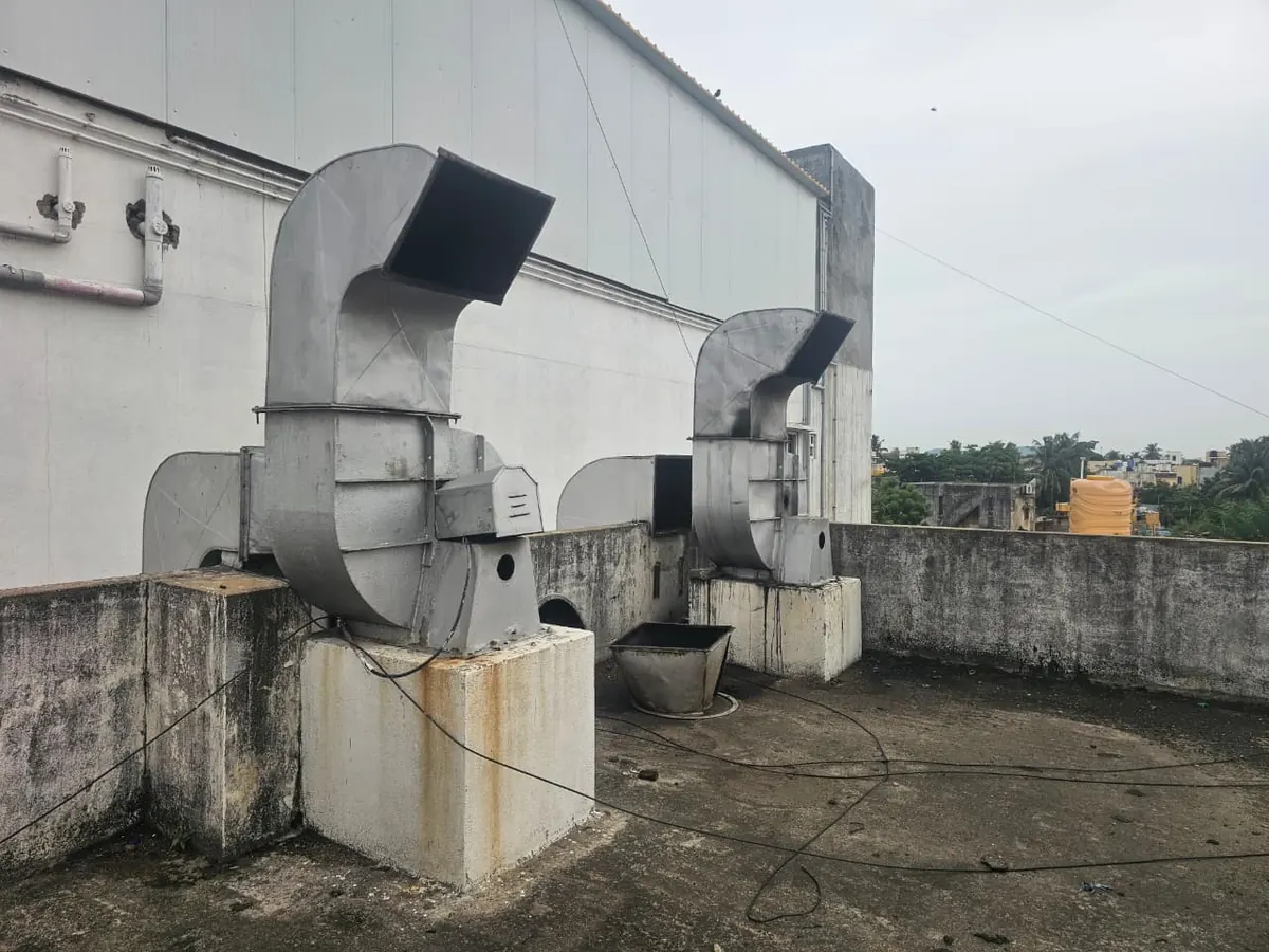 Two exhaust blower units installed side by side on a terrace