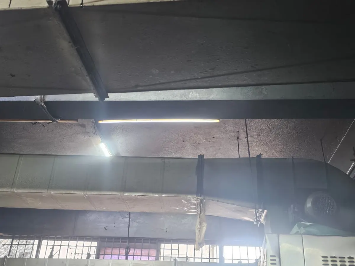 Long duct run carried under the roof of a large kitchen