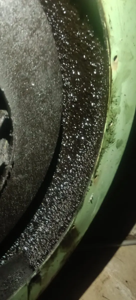 Inside view of a blower casing coated with grease before cleaning